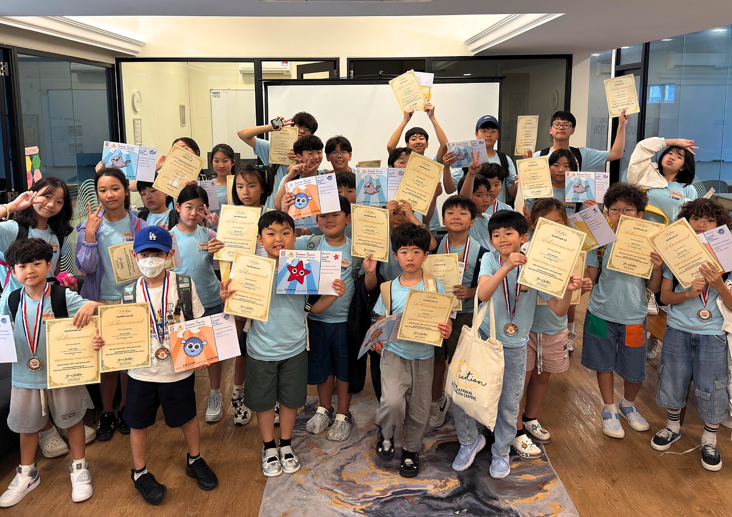 Students holding their certificates