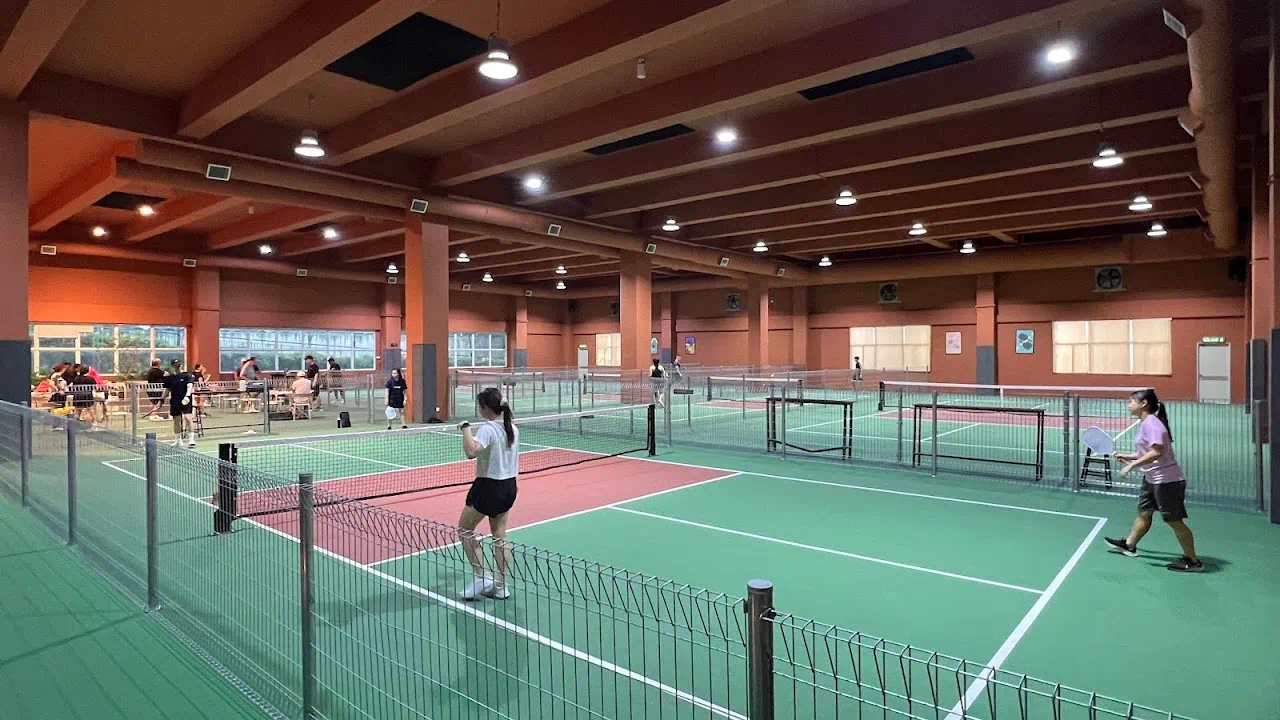 People playing on an indoor pickleball court